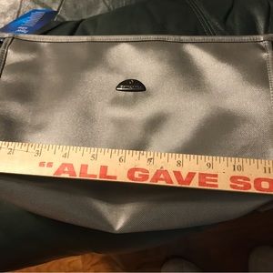 Travel bag. Silvery gray in color Zip closure. From pet and smoke free home. NWT